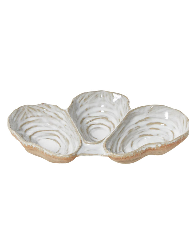 Three-section ceramic dish with a textured surface on a white background