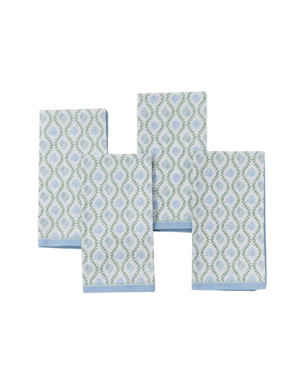 Set of four patterned towels on a white background