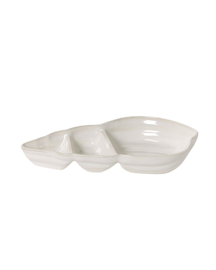 White ceramic dish with a wavy edge on a white background