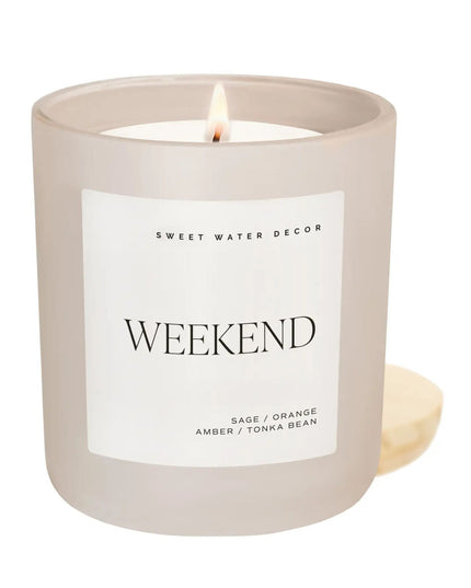 Candle in a beige holder with a label on a white background