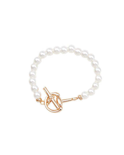 A pearl beaded bracelet with a gold toggle clasp, displayed on a clean white background.