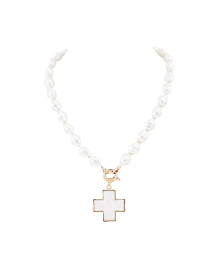 A white pearl necklace with a gold-tone cross pendant featuring a white inlay, displayed on a solid white background.
