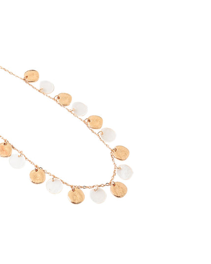 A delicate gold chain necklace featuring multiple small, irregularly shaped gold and white disc charms, displayed on a clean white background.
