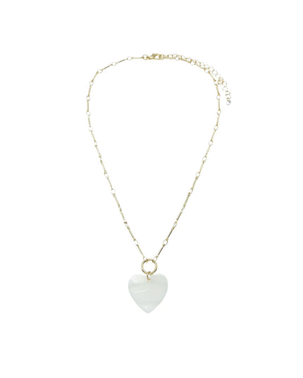 A delicate gold chain necklace featuring a small, smooth white heart-shaped pendant, displayed against a solid white background.