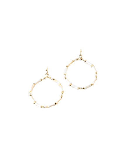 A pair of gold-tone hoop earrings with small white beads spaced along the outer edge, shown on a plain white background.