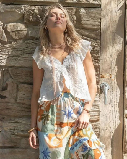 Ruffle Sleeveless V-Neckline Lace Detail Flyaway Hem Top